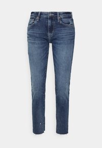 Mörkblå denimjeans med rak passform, med subtila blekningar och slitna detaljer, avslutade med råa fransar och femfickdesign.