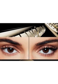 Close-up of brown eyes showing natural lashes on left and longer, fuller lashes with mascara on right, with mascara tube above.