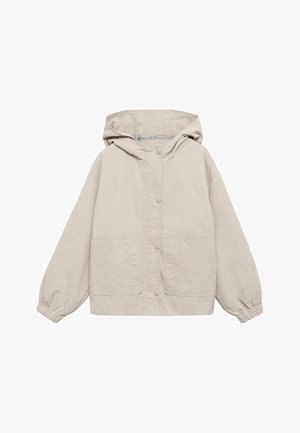 Lys beige hættetrøjejakke med frontknapper, to forlommer og elastiske manchetter på lange ærmer.