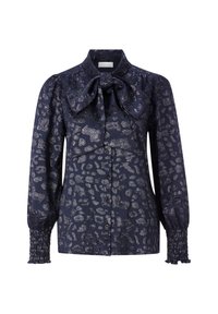 Navy blouse with leopard print, featuring a bow tie collar, button front, and smocked cuffs. Made of a textured fabric with sheen.