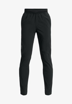 Pantalones deportivos negros con una cintura elástica, un ajuste tapered y acentos texturizados en los paneles laterales, que presentan un sutil logotipo.
