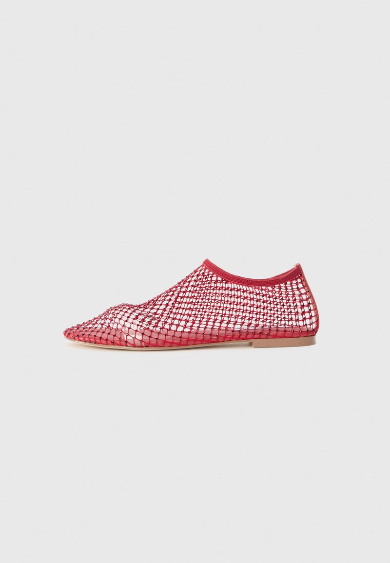 Red mesh flats with a pointed toe and flexible sole. Features a breathable net-like upper and a smooth interior lining.