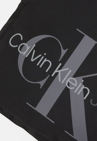 Calvin Klein Jeans SPORT ESSENTIALS REPORTER UNISEX - Borsa a tracolla - black
