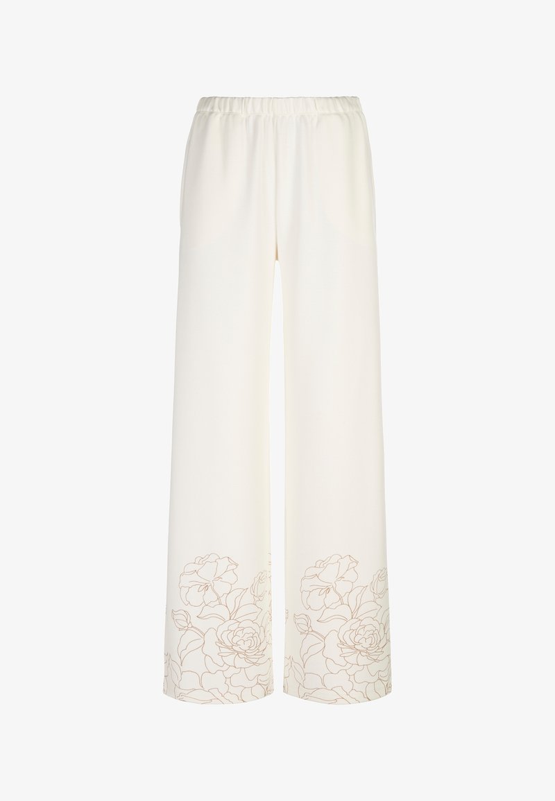 Pantalon crème à jambes larges avec taille élastique et motif floral subtil près des ourlets.