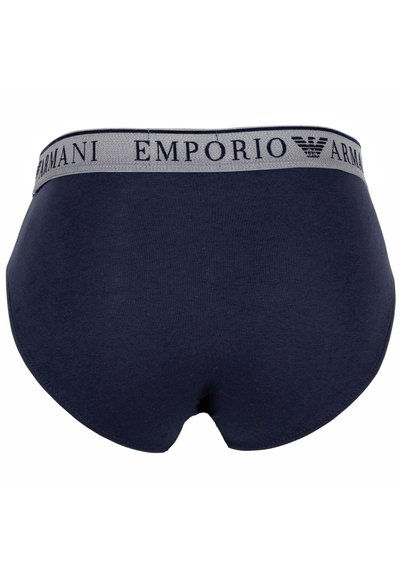 Culottes en coton bleu marine avec une ceinture grise arborant le logo "Emporio Armani". Texture lisse, forme ajustée et sans motifs visibles.