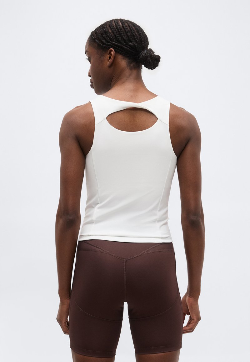 Puma SUNDAY BLISS TRAINING TWIST TANK - Top - white