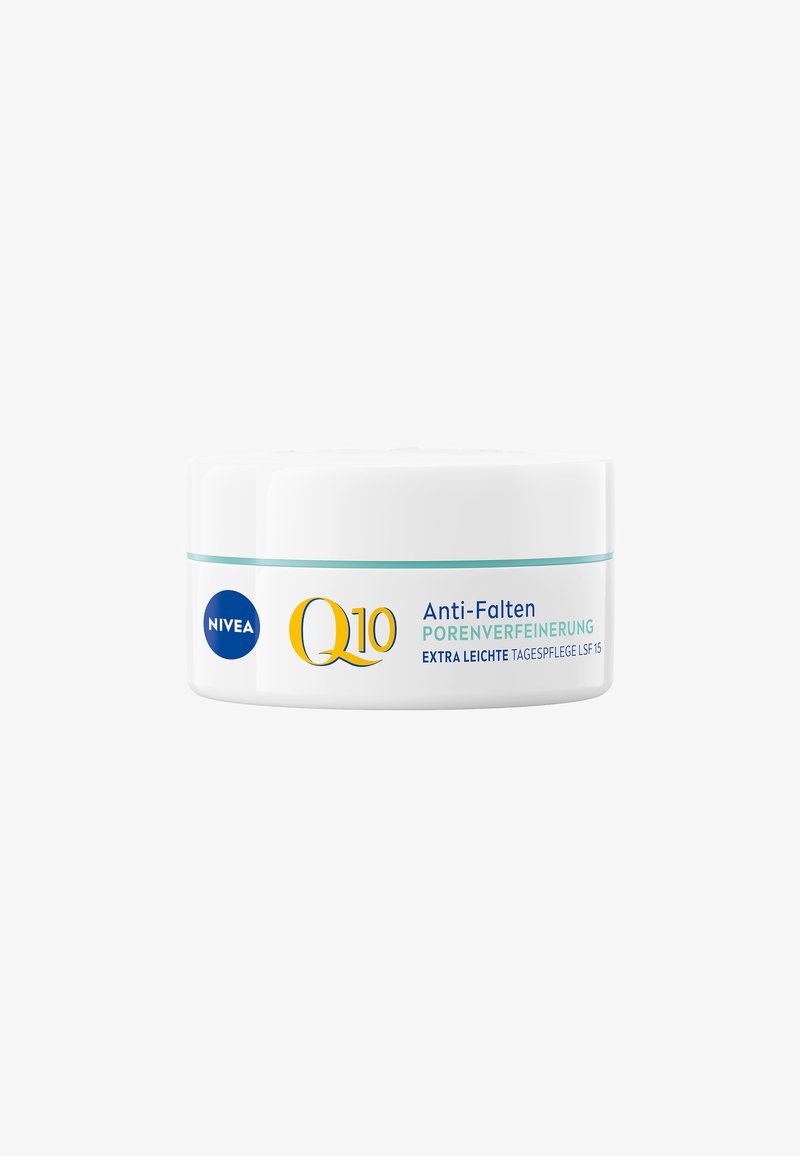 White circular jar with a teal accent band, labeled "NIVEA Q10 Anti-Falten" and "Porenverfeinerung," featuring a blue logo and yellow lettering.