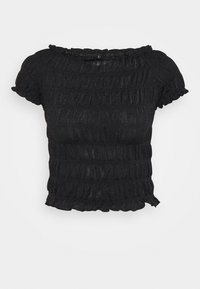 Svart kortärmad topp med en texturerad, samlad design och volangkant vid halsringning och nederkant; tillverkad av ett något glittrande material.