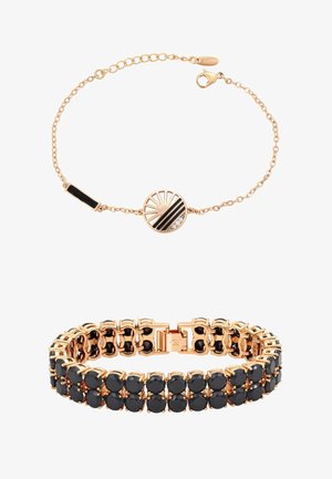 Dwie bransoletki: delikatny łańcuszek z różowego złota z czarnym i przezroczystym geometrycznym zawieszkiem oraz bransoletka z różowego złota z ogniwami, ozdobiona dwoma rzędami czarnych kamieni.