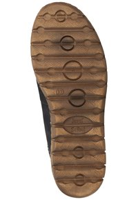 Suola in gomma marrone con motivi di presa testurizzati; sezioni ovali e circolari; logo in rilievo "Josef Seibel" vicino al tallone.