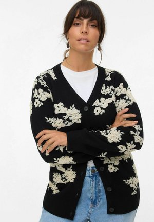 Black cardigan with white floral pattern, v-neck, long sleeves, and button closure; made of soft knit fabric, suitable for layering.