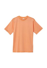 T-shirt met korte mouwen in zacht oranje katoen. Heeft een ronde halslijn en subtiele stikseldetails langs de schouders en de zoom.
