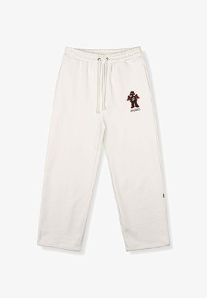 White cotton sweatpants with an elastic waistband. Features a black and red graphic on the left leg and white drawstring details.