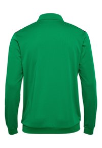 Grøn langærmet polo shirt lavet af et tekstureret stof med krave og ribbede mansjetter. Har en glat finish og et ensfarvet design.