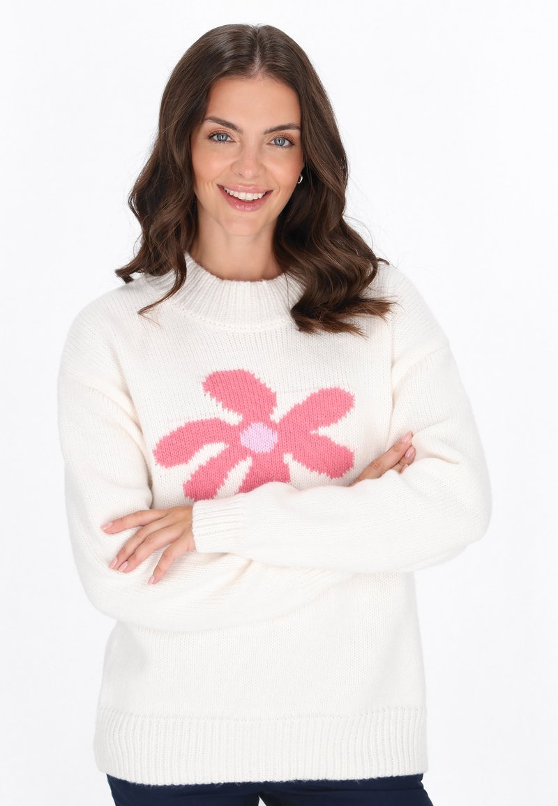 Sweter w kolorze off-white z okrągłym dekoltem i długimi rękawami. Posiada duży różowy wzór kwiatu na środku oraz ściągacze na rękawach i u dołu.