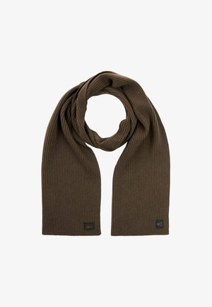 Brun, riflet tørklæde lavet af blødt stof, med en firkantet logo-patch i den ene ende. Teksturen er glat med et hyggeligt udseende.