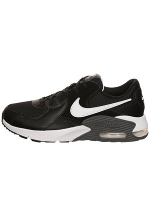 Czarno-białe tenisówki Nike Air Max, widok z boku, z siateczkową i skórzaną cholewką oraz widoczną amortyzacją powietrzną w podeszwie.