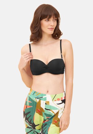 Haut de bikini noir à armatures avec centre froncé, bretelles réglables et texture lisse. Associé à un pantalon à motifs multicolores.