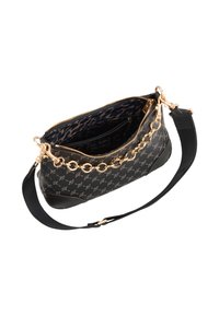 Sac noir avec un extérieur à motifs, accent chaîne en or et fermeture zippée. L'intérieur est doublé d'un imprimé léopard et comporte une petite poche.