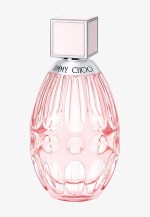 Pink translucent faceted perfume bottle with silver neck engraved "Jimmy Choo" and a square pale pink cap on a white background.