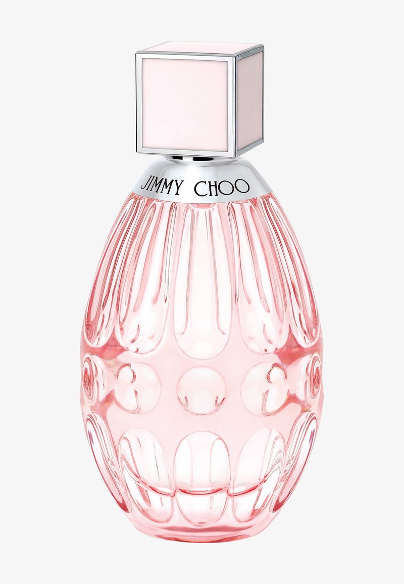 Pink translucent faceted perfume bottle with silver neck engraved "Jimmy Choo" and a square pale pink cap on a white background.
