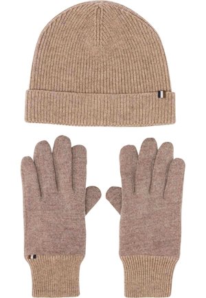 Beige ribbed knit beanie hat and matching soft fabric gloves with ribbed cuffs, laid flat on a white background.