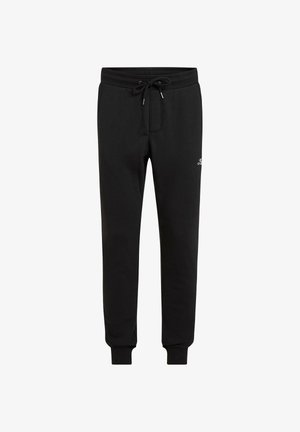 Čierne tepláky z mäkkej látky s elastickým pásom a nastaviteľným šnúrkou, zúženými nohavicami a logom na stehne.