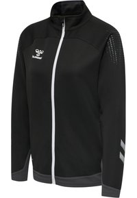 Sort sportjakke med lynlås med hvid lynlås, grå manchetter, perforerede mønstre på skuldrene og hvid hummel-logo på venstre bryst.