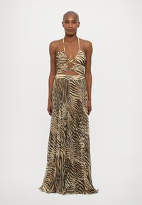 Abito lungo con stampa zebra beige e marrone. Presenta un collo all'americana, un'apertura in vita e sottili spalline verde neon. Tessuto dalla texture liscia.