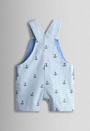 Triibulised sinised ja valged lühikesed tööpüksid, millel on väikesed tumesinised ankrumustrid, reguleeritavate õlapaeltega ja pehme tekstuuriga.