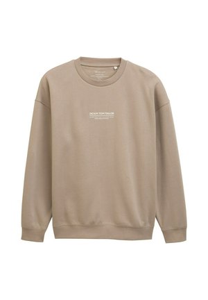Beige sweatshirts, jotka on valmistettu pehmeästä puuvillasta, pyöreällä kaula-aukolla, pitkillä hihoilla ja valkoisella logolla painettuna rintaan. Sujuva, rento istuvuus.