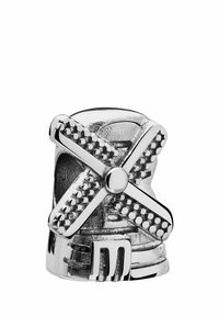 Silver-toned windmill-shaped ring with cross blades, dotted accents, and a textured base, featuring polished and matte finishes.