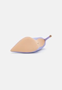 Lilac high-heeled shoe with a pointed toe, smooth texture, and a tan rubber sole, featuring a small gold accent on the back heel.