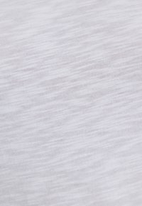 White textured fabric with subtle gray streaks, lightweight and soft. Material appears smooth with a slight sheen, suitable for casual wear.