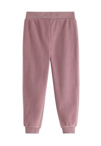 Fleece-Jogginghose in sanftem Pink mit geripptem Bund und Abschlüssen. Glatte Textur, zulaufende Beine und minimale Nähdetails.