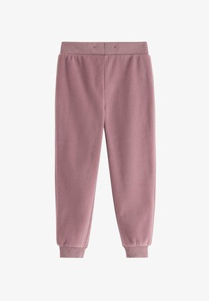 Fleece-Jogginghose in sanftem Pink mit geripptem Bund und Abschlüssen. Glatte Textur, zulaufende Beine und minimale Nähdetails.