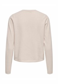 Haut beige clair à manches longues, fabriqué en tissu doux. Comprend un col rond, des poignets côtelés et un ourlet droit. Design simple et épuré.