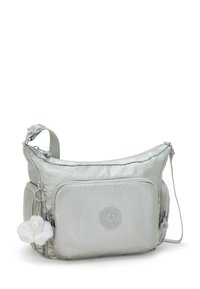 Light silver shoulder bag made of smooth fabric, featuring a front zip pocket and a plush monkey charm attached to the zipper.