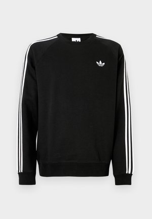 Sudadera negra con diseño de tres franjas blancas a lo largo de las mangas y pequeño logo blanco en el pecho. Hecha de un material suave con puños acanalados.