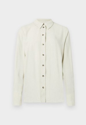 Lys beige knapp-skjorte med krage, lange ermer og metallknapper foran. Teksturert stoff.