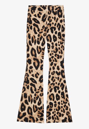 Pantalons évasés imprimés léopard avec une texture côtelée, de couleur beige et noire, présentant des motifs de taches variés sur l'ensemble du tissu.