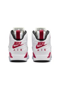 Sneakers Nike bianchi con accenti rossi e neri, dotati di colli imbottiti, linguette e ammortizzazione visibile nelle suole.