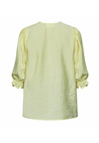 Lys gul bluse med puffede ærmer og elastiske manchetter, med en struktureret stof og en rund halsudskæring, set bagfra.