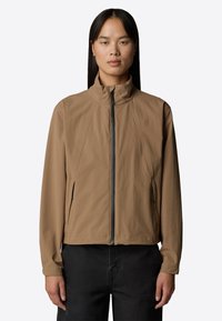 Lightweight, brown jacket with a high collar, full zipper, and side pockets; features a smooth texture and fitted design.