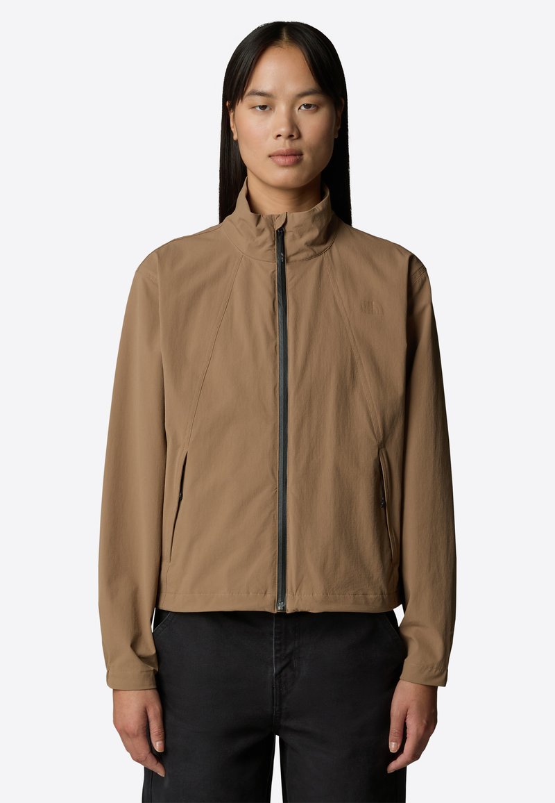 Lightweight, brown jacket with a high collar, full zipper, and side pockets; features a smooth texture and fitted design.