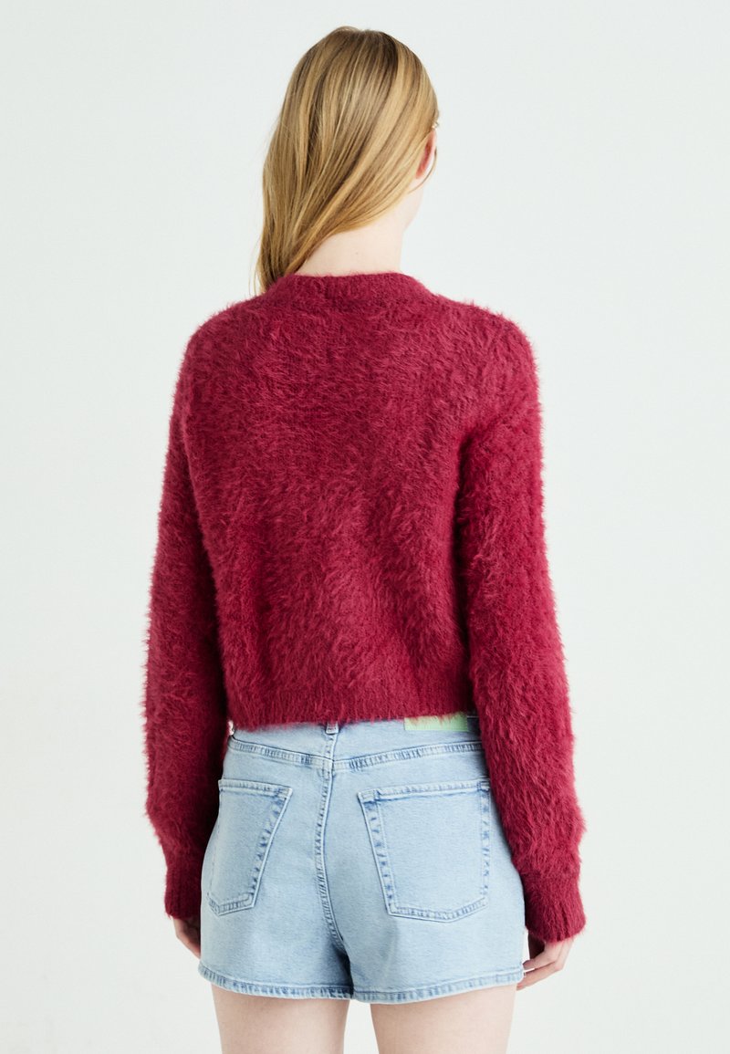 Pull sans manches col rond rose corail femme | La Halle
