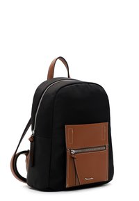 Black backpack with brown leather front pocket and handle, silver zipper, and adjustable shoulder straps.