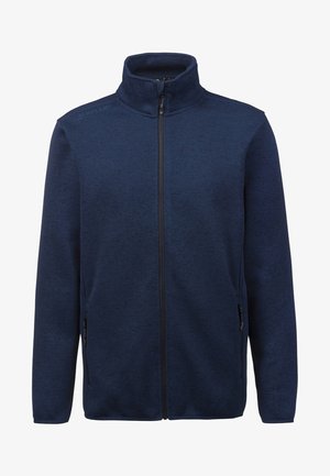 Giacca in pile blu navy con zip, colletto alto, tasche laterali e tessuto testurizzato. Presenta una zip liscia e una marcatura minima sulla spalla.