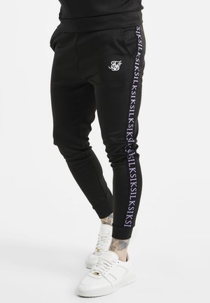 TAPED CUFFED - Spodnie treningowe - black