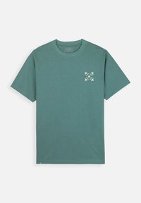 T-shirt en coton teal avec un col rond. Présente un motif floral en blanc et jaune sur la poitrine gauche. Manches courtes, coupe décontractée.